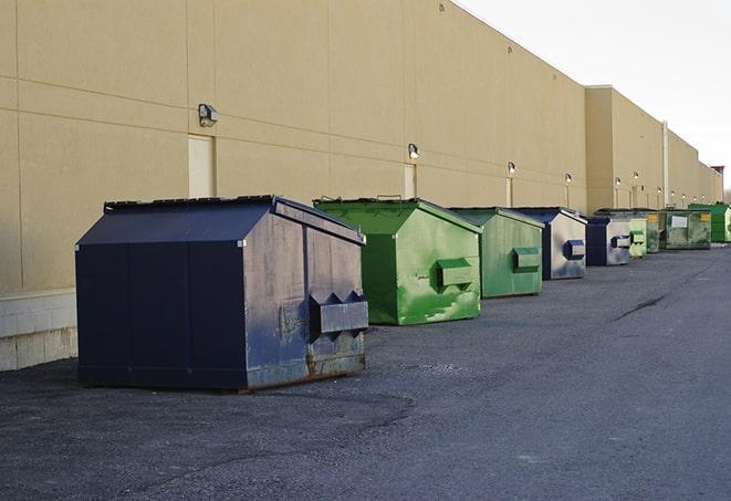 a row of industrial dumpsters at a construction site in Atlanta